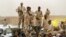FILE - Sudanese soldiers from the Rapid Support Forces stand on their vehicle during a military-backed rally in Mayo district, Sudan, on June 29, 2019. Experts attribute some of the blame for the current political and social instability in Sudan on climate change.