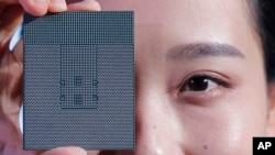 FILE - A Kunpeng 920 chip is displayed during a ceremony in Shenzhen, China, Jan. 7, 2019. 