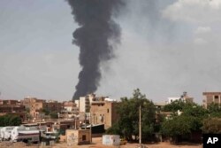 FILE - Smoke rises over Khartoum, Sudan, on June 8, 2023, as fighting between the Sudanese army and paramilitary Rapid Support Forces continued.