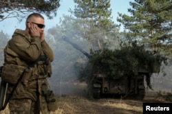 Ukrainian servicemen of the 93rd Separate Mechanized Brigade "Kholodnyi Yar" fire a M109 self-propelled howitzer towards Russian troops, in the Donetsk region, on March 31, 2024. (Sofiia Gatilova/Reuters)