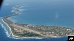 FILE - Funafuti, the main island of the nation state of Tuvalu, is photographed from a Royal New Zealand air force C130 aircraft as it approaches the tiny South Pacific nation. 