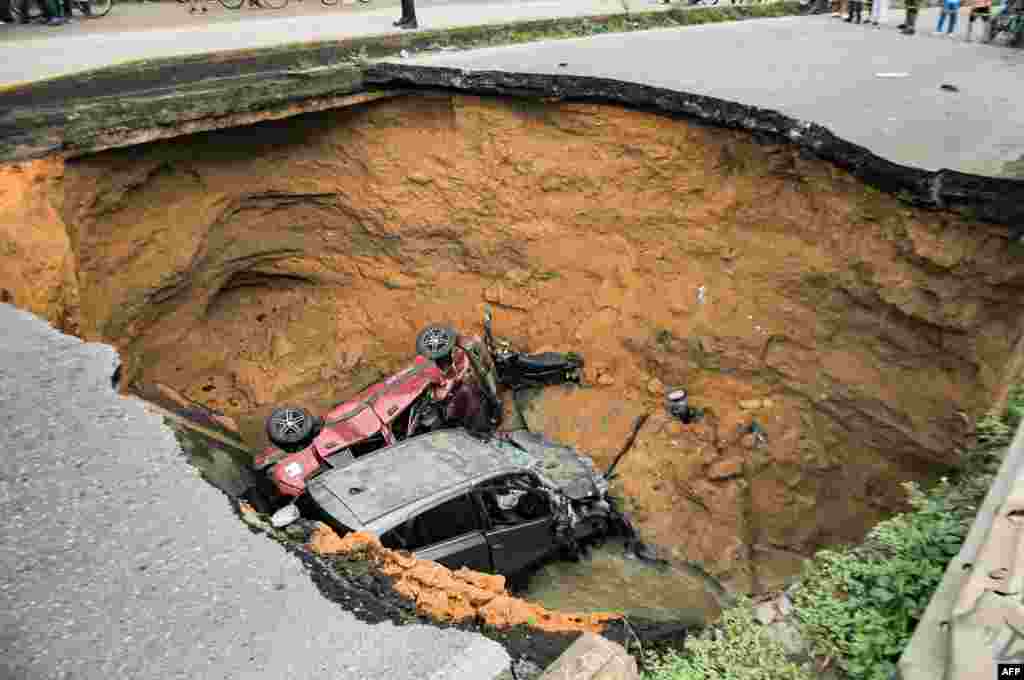 Damaged cars are seen after the collapse of a bridge in Barranquilla, Colombia, that left four people dead and three injured, according to local authorities.