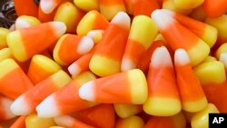 This image shows a pile of candy corn in Westchester County, New York, Oct. 23, 2023. Cruel joke for trick-or-treaters or coveted seasonal delight? The great Halloween debate over candy corn is on. 
