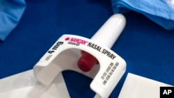 FILE - A container of Narcan, a brand-name version of the opioid overdose-reversal drug naloxone, sits on a table following a demonstration at the Health and Human Services Humphrey Building on Sept. 8, 2023, in Washington. 