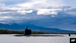 FILE - The submarine USS Missouri departs Joint Base Pearl Harbor-Hickam for a scheduled deployment, Sept. 1, 2021. (U.S. Navy via AP)