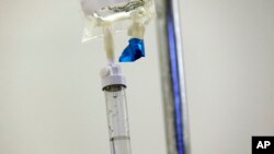 FILE - Chemotherapy drugs are administered to a patient in Chapel Hill, N.C., May 25, 2017. Many U.S. hospital pharmacists have had to ration, delay or cancel treatments as drug shortages approach an all-time high, a survey released Aug. 10, 2023, found.