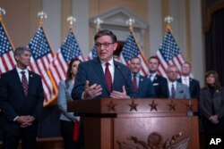 Speaker of the House Mike Johnson, R-La., joined by fellow Republicans, speaks during a news conference at the Capitol in Washington, March 6, 2024.
