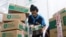 An employee packs goods at Goto's e-commerce unit Tokopedia's warehouse in Jakarta, Indonesia, August 31, 2022. REUTERS/Ajeng Dinar Ulfiana