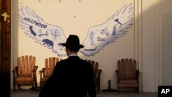 A man walks to his synagogue in Los Angeles before sunset on Oct. 7, 2023. 