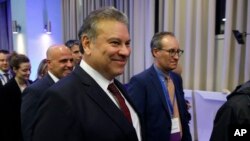 FILE - Special Representative to the Western Balkans, Gabriel Escobar, walks with others after a meeting between Serbia's President Aleksandar Vucic and Kosovo's Prime Minister Albin Kurti, at North Macedonia's lakeside resort of Ohrid, March 18, 2023. 