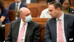 Alan Weisselberg, Donald Trump's longtime finance chief, left, sits inside New York Supreme Court, Oct. 10, 2023. 