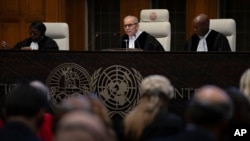 Presiding Judge Nawaf Salam reads the ruling of the International Court of Justice, or World Court, in The Hague, Netherlands, May 24, 2024.