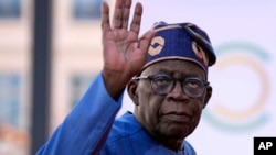 FILE - Nigeria's President Bola Tinubu arrives for the closing session of the New Global Financial Pact Summit, on June 23, 2023 in Paris.