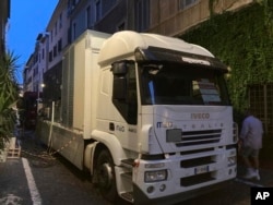 A truck of generators rented to provide power to a central Roman neighborhood hit by a localized blackout blocks the doors of stores forcing them to shut down for a week, July 25, 2023.