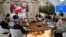Summit host, Italian Prime Minister Georgia Meloni, top center, addresses fellow G7 leaders during a roundtable session on the first day of their summit, at Borgo Egnazia, southern Italy, June 13, 2024.