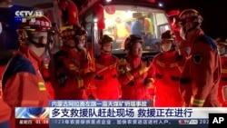 In this image taken from video footage run by China's CCTV, rescuers gather at the site of a mine collapse in Alxa League in northern China's Inner Mongolia, Feb. 22, 2023.