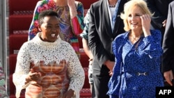 Kenyan first lady Rachel Ruto, left, welcomes U.S. first lady Jill Biden, right, upon her arrival at the Jomo Kenyatta International Airport in Nairobi on Feb. 24, 2023.