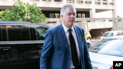 FILE - Attorney M. Evan Corcoran arrives at federal court in Washington, July 22, 2022. 