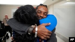 Valerie Laveus greets her brother Reginald Malherbe Daniel as he arrives from Haiti in Fort Lauderdale, Florida, on Aug. 9, 2023. Under a humanitarian parole program, up to 30,000 people are allowed each month to enter the U.S. from Cuba, Haiti, Nicaragua and Venezuela