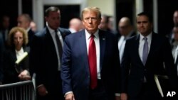 FILE - Former President Donald Trump leaves Manhattan Criminal Court in New York, Feb. 15, 2024. In a new filing to the U.S. Supreme Court, Trump's lawyers argue that a former president should enjoy "absolute immunity from criminal prosecution for his official acts."