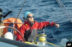 FILE - Sister Nathalie Becquart sails during a regatta in Brest, France on April 2010. Becquart, the first female undersecretary in the Vatican's Synod of Bishops, is one of the highest-ranking women at the Vatican. (Bishop Conference of France via AP)