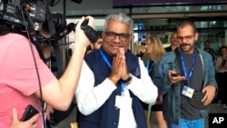 Bhupender Yadav, India's environment and labor minister, leaves a plenary session at the COP28 U.N. Climate Summit, Dec. 13, 2023, in Dubai, United Arab Emirates.