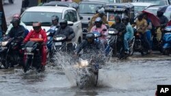 Motorists ride as it rains in Hyderabad, India, Sept. 5, 2023. Despite the September rain, India's monsoon rainfall this year was its lowest since 2018 as the El Nino weather pattern made August the driest in more than a century, according to the state-run weather department.