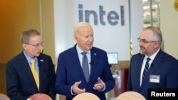 President Joe Biden tours the Intel Ocotillo campus in Chandler, Ariz., with Intel CEO Pat Gelsinger (left) and factory manager Hugh Green on March 20, 2024.