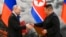 FILE - Russian President Vladimir Putin, left, and North Korea's leader Kim Jong Un exchange documents during a signing ceremony of a new partnership agreement in Pyongyang, North Korea, June 19, 2024.