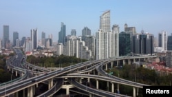 FILE - An aerial view shows highways and buildings in Shanghai, China, March 30, 2022. 