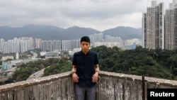 FILE - Pro-democracy activist Owen Chow reacts during an interview in Hong Kong, China February 8, 2021. (REUTERS/Tyrone Siu)