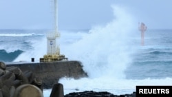 A high wave caused by typhoon Khanun hits a seawall in Seogwipo on Jeju island, South Korea, August 9, 2023. (Yonhap via REUTERS)