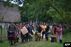 Italian archeologist Alberto Sarcina and assistants pose on Sept. 16, 2023, at Santa Maria de la Antigua del Darien. Indigenous, Black and peasant women from the community are participating in the decade-long excavation work.