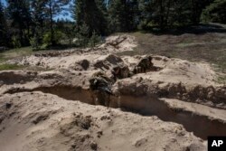 Ukrainian Border Guard soldiers participate in a military exercise in central Ukraine, May 2, 2023.