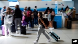 A person walks by the ticketing lobby at the Charlotte Douglas International Airport on May 25, 2023, in Charlotte, a city in the U.S. state of North Carolina.