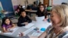 Fifth grade students attend a math lesson with teacher Jana Lamontagne, right, during class at Mount Vernon Community School, in Alexandria, Va., May 1, 2024. 