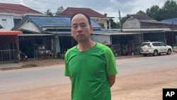 FILE - This photo from a source wishing to remain anonymous shows Chinese rights lawyer Lu Siwei on a road, at an undisclosed location, around 300 kilometers north of Vientiane, Laos, on July 27, 2023, as he headed south to the border with Thailand.