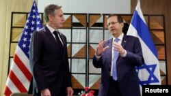 U.S. Secretary of State Antony Blinken meets Israel's President Isaac Herzog, during his week-long trip aimed at calming tensions across the Middle East, at David Kempinski Hotel, in Tel Aviv, Israel, Jan. 9, 2024.
