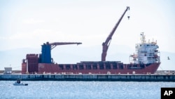 FILE - A Russian vessel, the Lady R, is docked at the Simon's Town naval base near Cape Town, South Africa, Dec. 8, 2022.