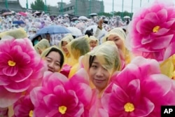 Buddhists wait for a lantern parade as part of festivities celebrating the birthday of Buddha, at Dongguk University in Seoul, South Korea, Saturday, May 11, 2024. (AP Photo/Ahn Young-joon)