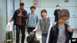 旅客抵達北京國際機場。 （2023年4月26日）