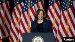 FILE - U.S. Vice President Kamala Harris reacts during a campaign event at West Allis Central High School, in West Allis, Wisconsin, July 23, 2024.