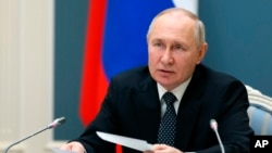 Russian President Vladimir Putin chairs a Security Council meeting via videoconference in Moscow, April 5, 2023. (Kremlin pool photo via AP)