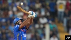 Mumbai Indians' Rohit Sharma plays a shot during the Indian Premier League cricket match between Mumbai Indians and Lucknow Super Giants in Mumbai, India, May 17, 2024.