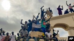 Supporters of Niger's ruling junta gather at the start of a protest called to fight for the country's freedom and push back against foreign interference in Niamey, Niger, Aug. 3, 2023.