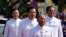 President of the National Assembly Heng Samrin, front, walks together with, Deputy Prime Minister and Minister of Interior Ministry Sar Kheng, right, Prime Minister Hun Sen, center, and Hun Manet, left, at the National Assembly in Phnom Penh, Cambodia, Monday, Aug. 21, 2023.