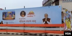 A banner with a cutout of Lord Ram on the consecration of the Ram Temple in Ayodhya welcoming guests and ordinary pilgrims to the town, Jan. 20, 2024. (Mohammad Arfan/VOA)