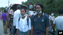 FILE - Journalists Kay Son Nway, left, and Ye Myo Khant stand together after their release from Insein Prison in Yangon, Myanmar, June 30, 2021. About 10 journalists were among the 2,153 political prisoners released May 3, 2023, to celebrate Buddha Day.