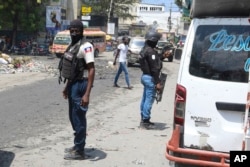 National Police patrol an intersection amid gang violence in Port-au-Prince, Haiti, April 8, 2024.