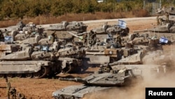 An Israeli tank maneuvers, amid the ongoing conflict between Israel and the Palestinian Islamist group Hamas, near the Israel-Gaza Border, in southern Israel, May 7, 2024. 